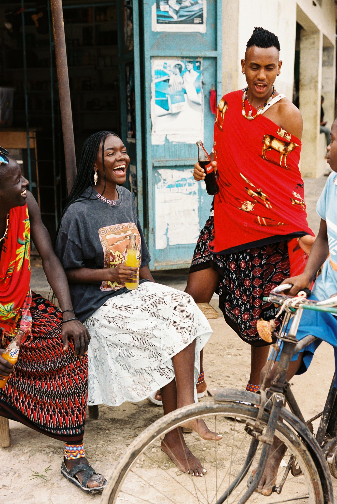 Woman wearing light blue lace skirt and an oversized black graphic tee