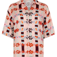 Floral patterned shirt with a brand label on a white background