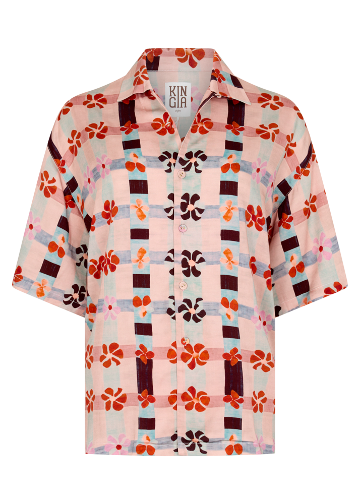 Floral patterned shirt with a brand label on a white background