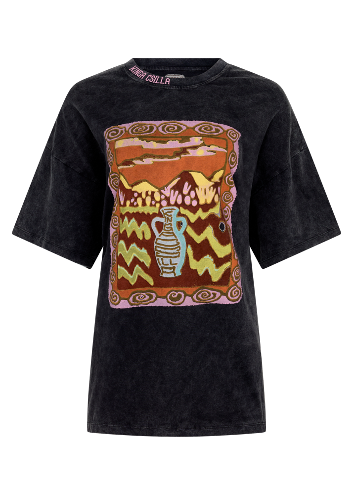 Black t-shirt with a colorful desert graphic design on a white background