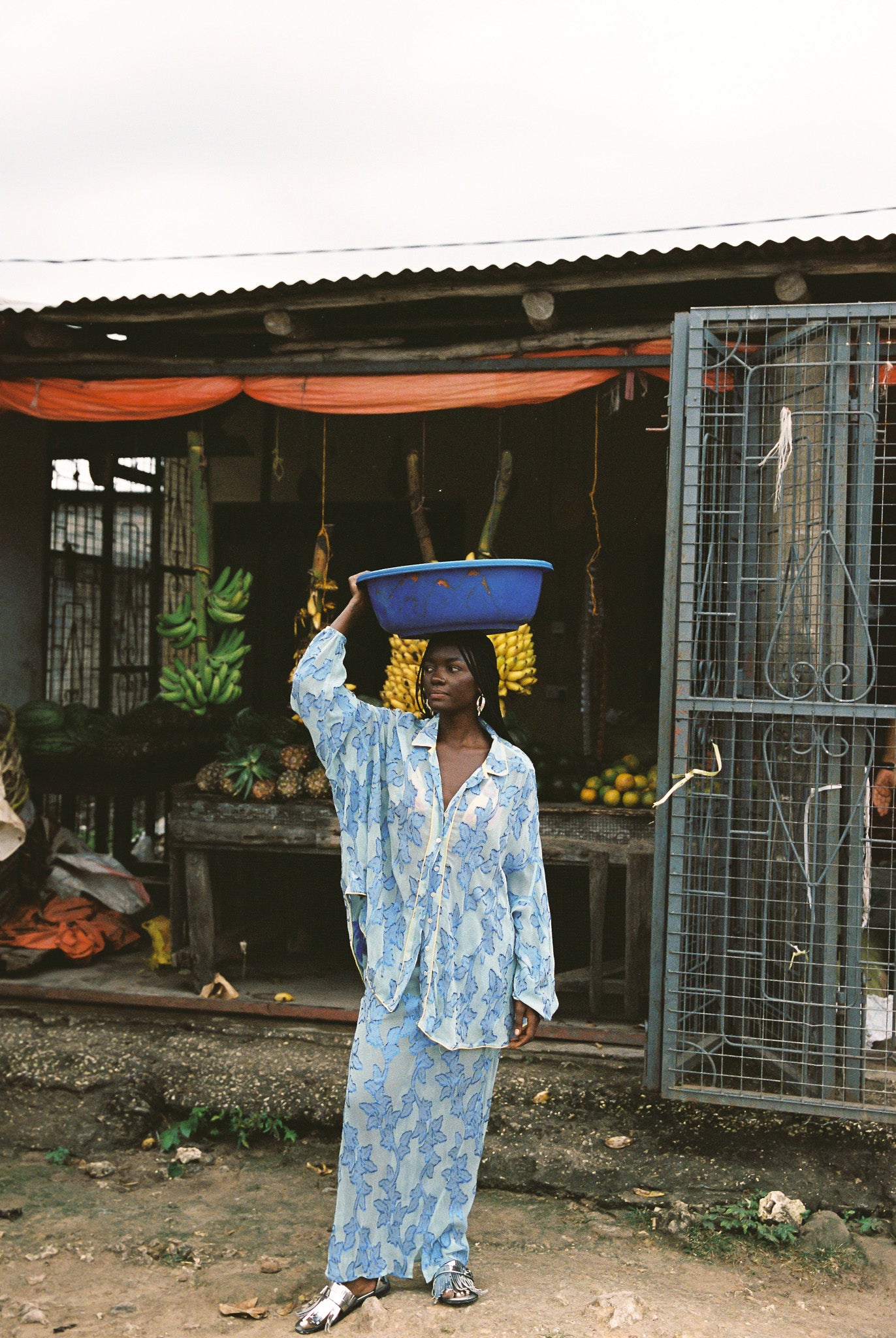Woman in semi-sheer blue botanical embroided skirt and skirt set.