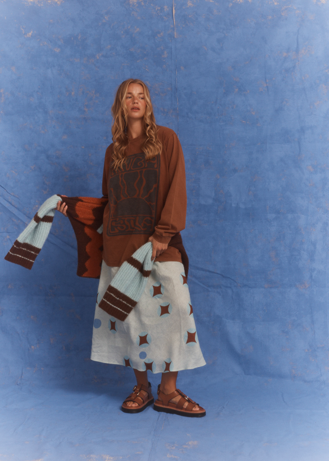 Model wearing Kinga Csilla Surf Citta Cardigan in brown, orange and blue, styled with the Aquarius Skirt and Lino Roses Tee. A relaxed bohemian look from Australian fashion label Kinga Csilla.