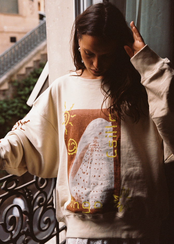 Kinga Csilla Shell OG Jumper cream oversized sweater, 100% cotton jersey, hand-drawn shell and sun doodle graphic, relaxed bohemian coastal loungewear style.