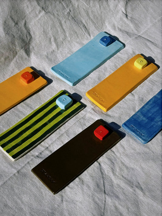 Kinga Csilla x Staycay ceramic incense holders handmade in Northern NSW, available in Green Stripe/Sky Blue, Brown/Red, Orange/Red, Orange/Yellow, Dark Blue/Sky Blue, and Sky Blue/Dark Blue colourways, glossy bohemian home décor for incense and aromatherapy.