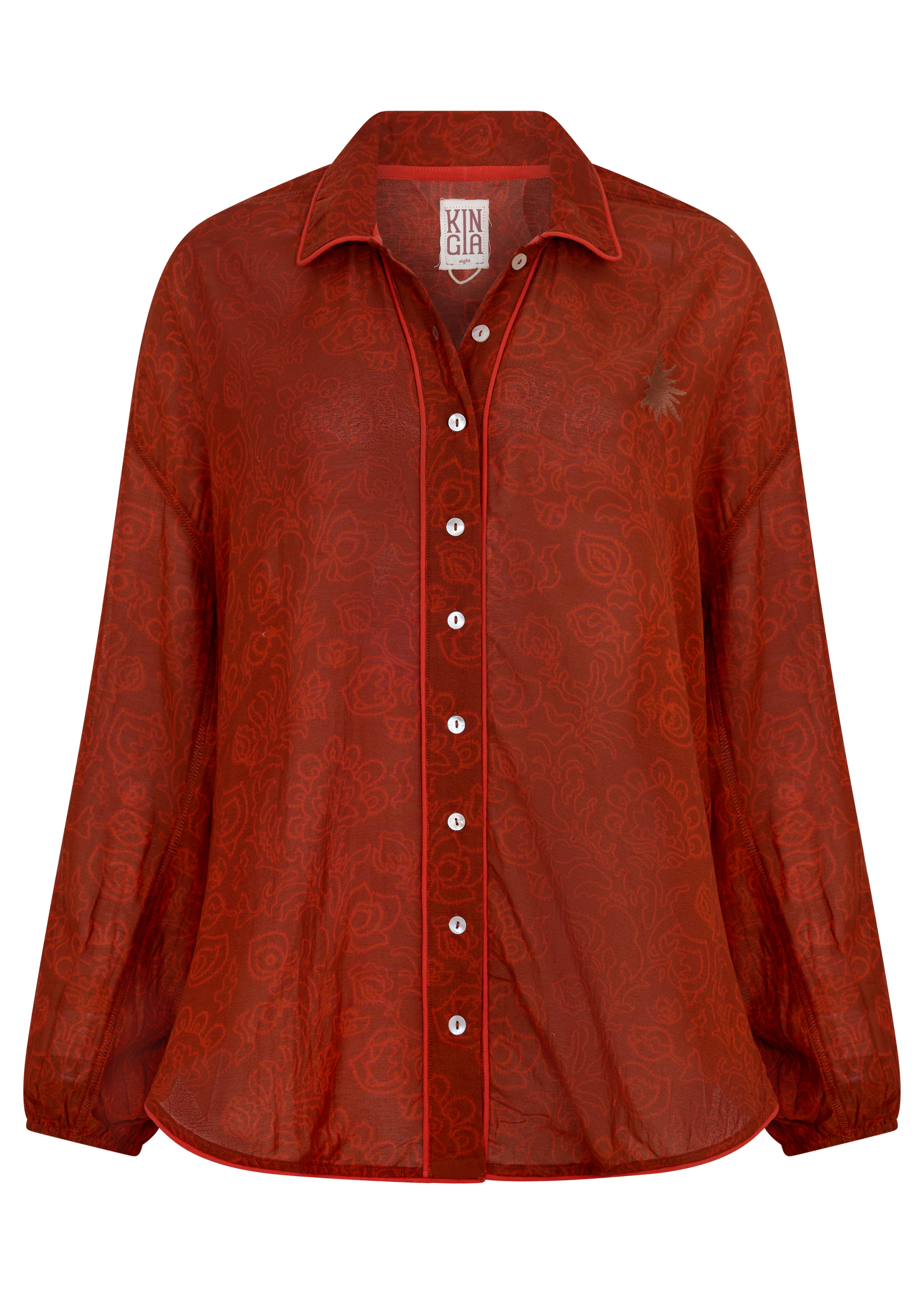 A red sheer long-sleeve button-up shirt with an all-over tonal floral jacquard pattern, featuring a pointed collar, white buttons, and a small embroidered star on the left chest.