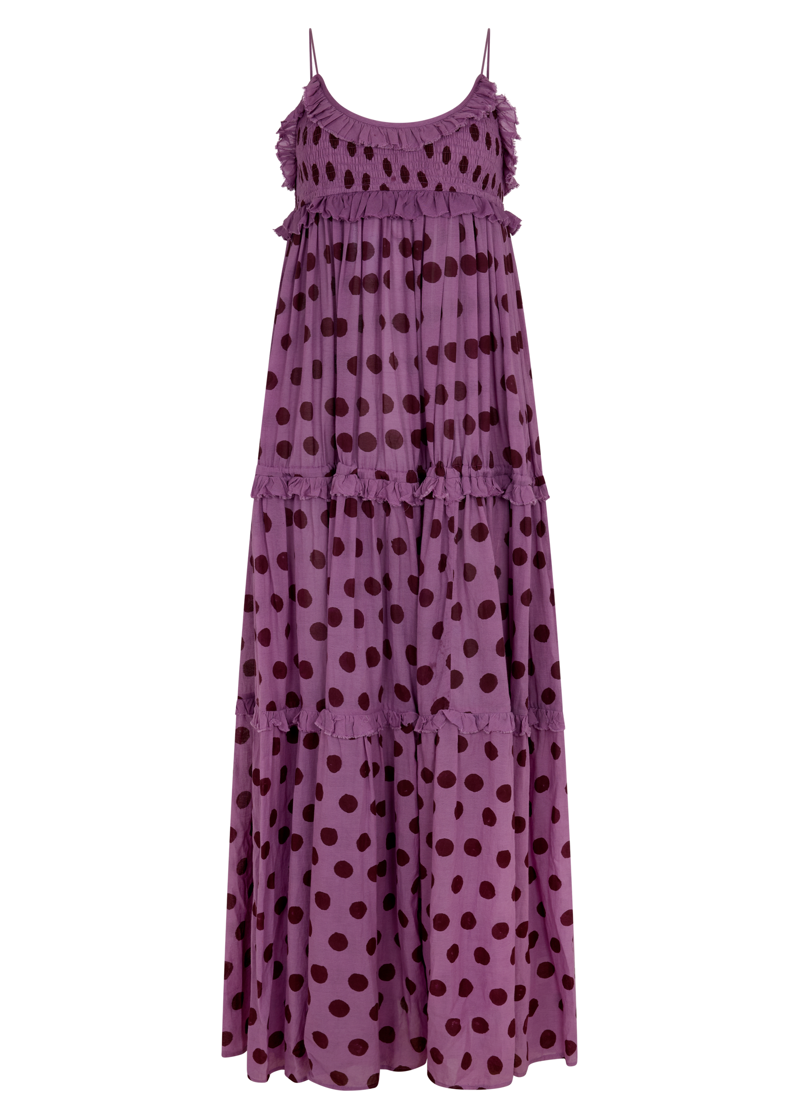 A tiered maxi dress in a dusty purple color with dark brown polka dots, featuring thin spaghetti straps and ruffled trim along the neckline and between the tiers, shown against a plain white background.