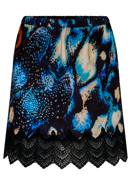 A short A-line skirt featuring a vibrant blue, black, orange and beige abstract print with a black scalloped lace hem, shown against a plain white background.