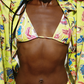 Person wearing a colorful yellow bikini with a vibrant pattern