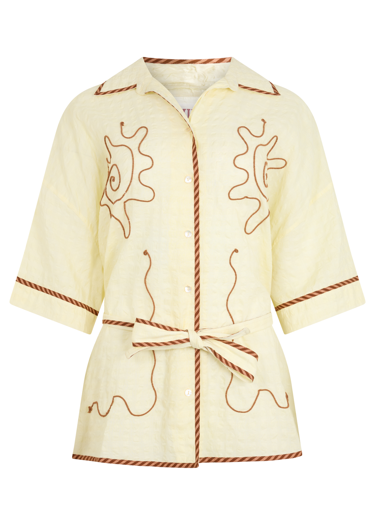 A kimono style cream shirt with brown embroidered details, displayed on a plain white background