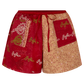Red and beige shorts with intricate patterns on a white background
