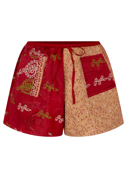 Red and beige shorts with intricate patterns on a white background
