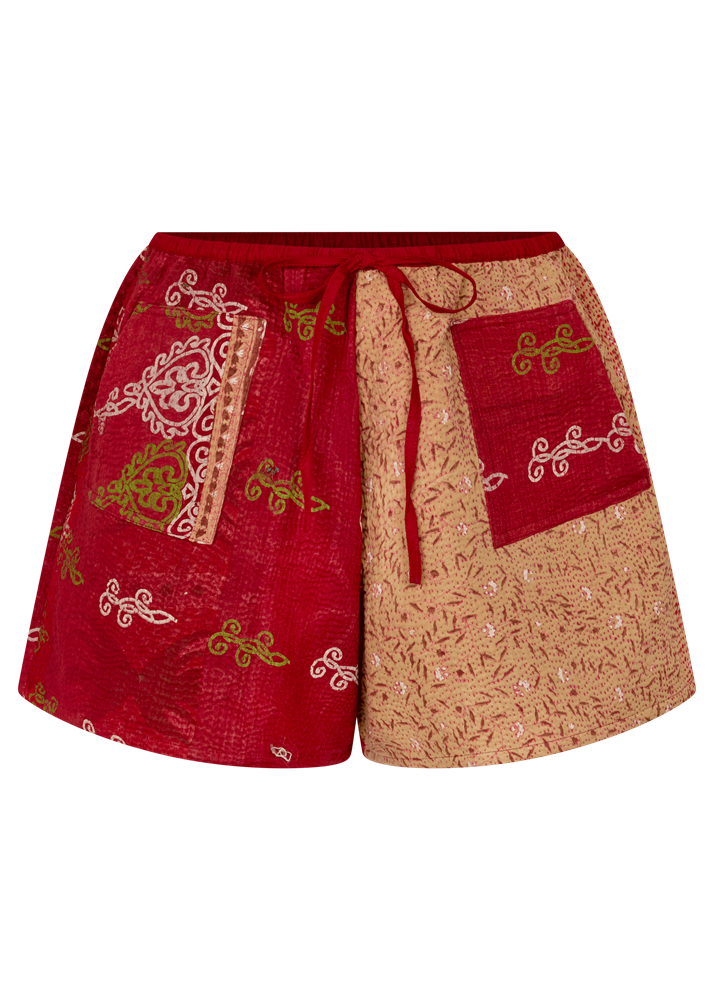 Red and beige shorts with intricate patterns on a white background