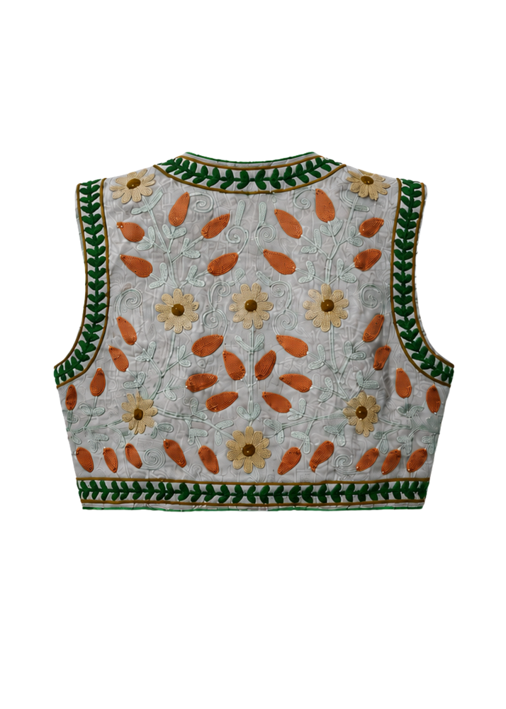 The back view of a sleeveless quilted vest featuring a light gray base with embroidered floral and leaf patterns in green, orange, and beige.