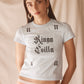 Woman wearing light blue cropped cotton tee with vintage gothic logo print, soft feel, and fitted silhouette