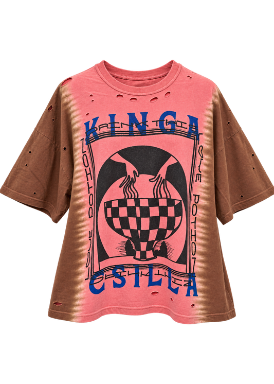 A pink and brown tie-dye shirt with a black graphic print and blue 'KINGA CSILLA' text, displayed on a white background.