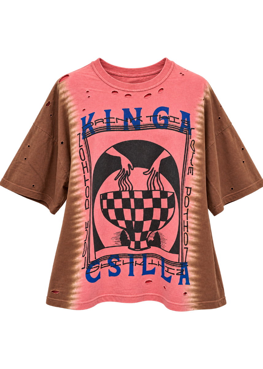 A pink and brown tie-dye shirt with a black graphic print and blue 'KINGA CSILLA' text, displayed on a white background.