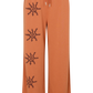 Flat lay of Kinga Csilla Abracadabra Hades Pant in bright orange with sun spiral graphic print on right leg, featuring elasticated waistband, drawstring, and flared wide-leg hem