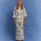 Model wearing Kinga Csilla Aquarius Chalm Shirt and matching Aquarius Chalm Skirt set in linen, photographed against a blue studio backdrop