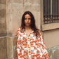 Kinga Csilla Farfalla Chalm Shirt in orange butterfly and cloud print, styled with matching Farfalla Jessi Pant. Oversized long-sleeve button-up shirt and wide-leg pants set for women, relaxed fit co-ord outfit.