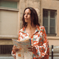 Kinga Csilla Farfalla Chalm Shirt in orange butterfly print, oversized long sleeve button-up shirt styled with city map for summer street style